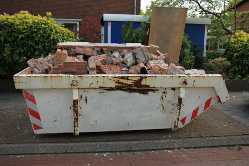 Clearing out old furniture in a Finchley home